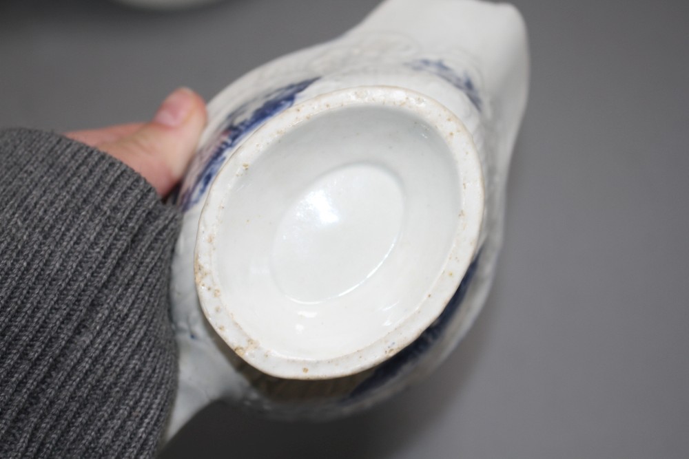 A Lowestoft blue and white sauceboat, c.1770 and two Worcester blue and white sauceboats, c.1758-65
